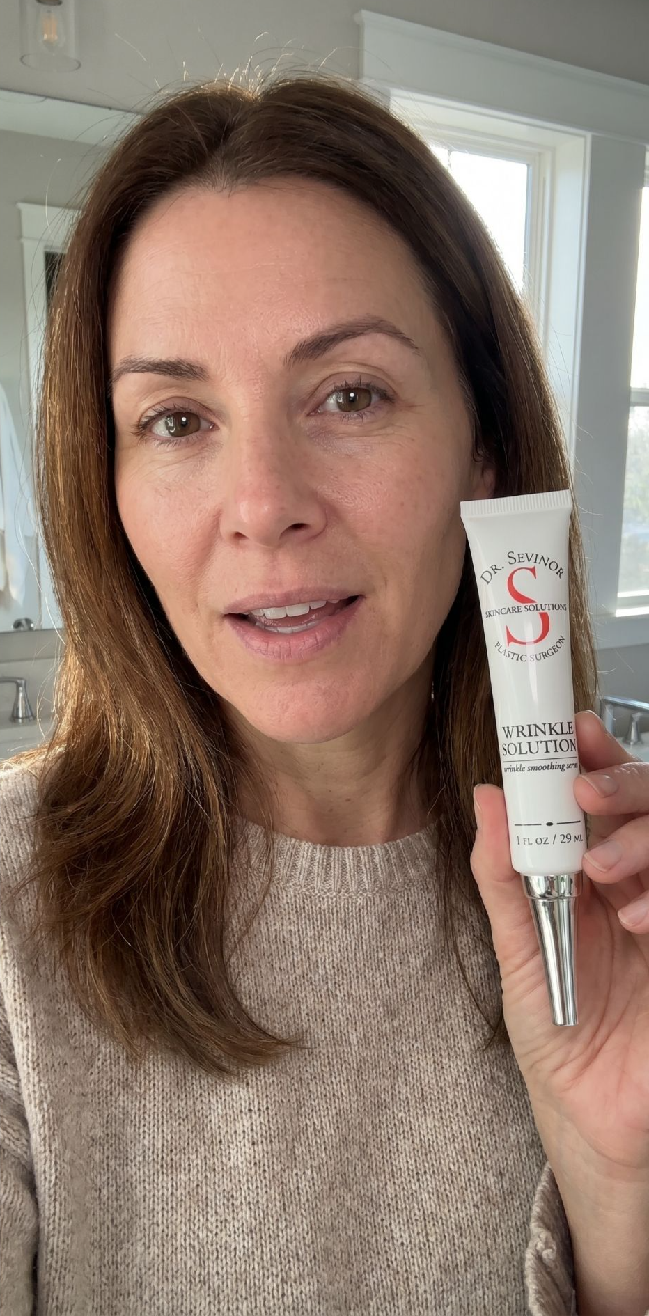 Woman holding the Wrinkle Solution tube