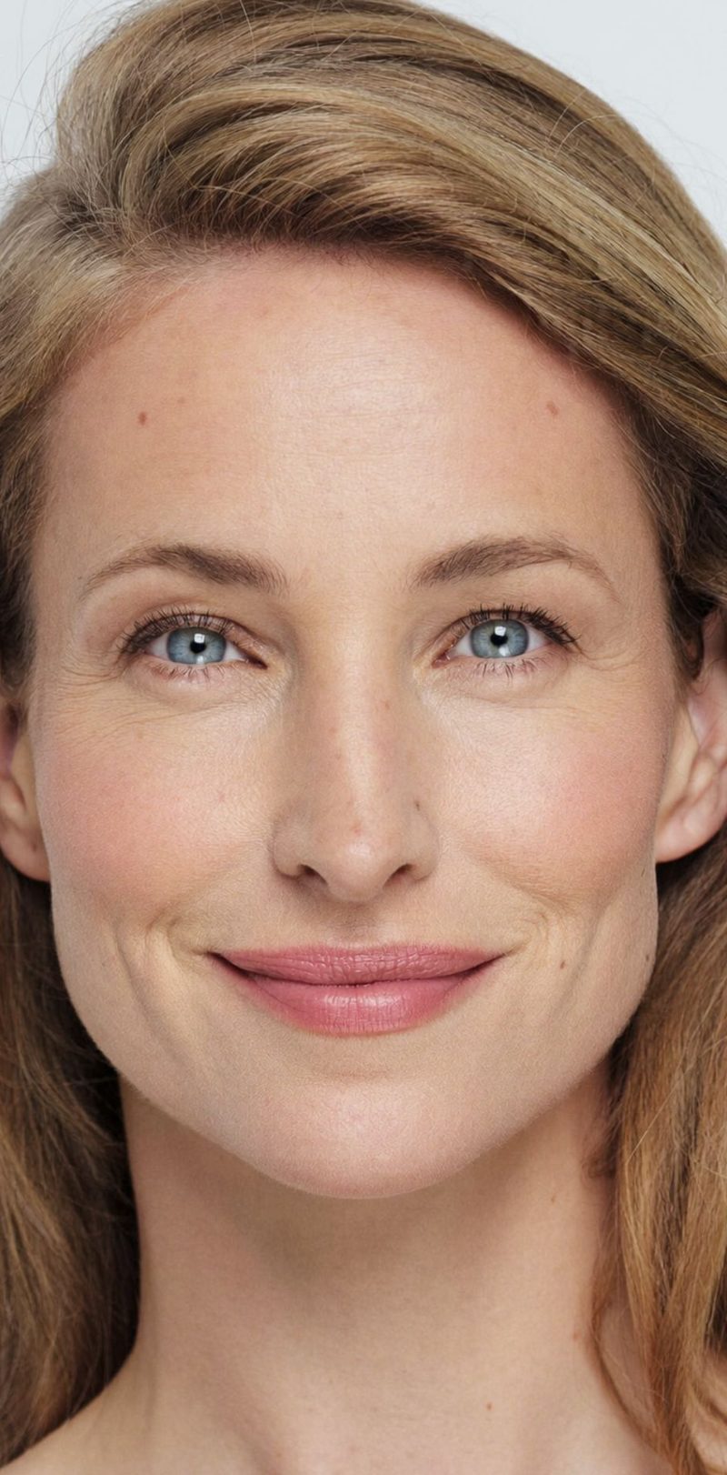 Close portrait of a woman with smooth, clear skin